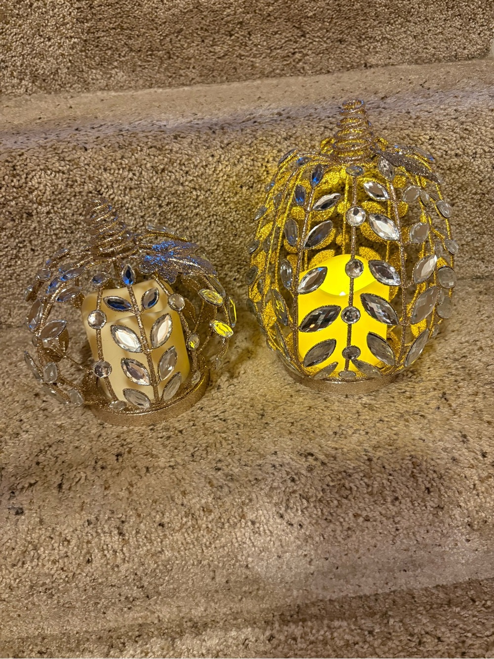 Two gold glitter and gem timer battery op pumpkins.